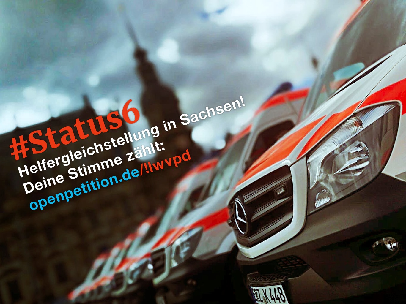 Eine Reihe von Rettungswagen unter dramatischem Himmel ist zu sehen. Quer über dem Bild steht "#Status6 Helfergleichstellung in Sachsen! Deine Stimme zählt:" Darunter ist der Link zur entsprechenden Petition angegeben. 